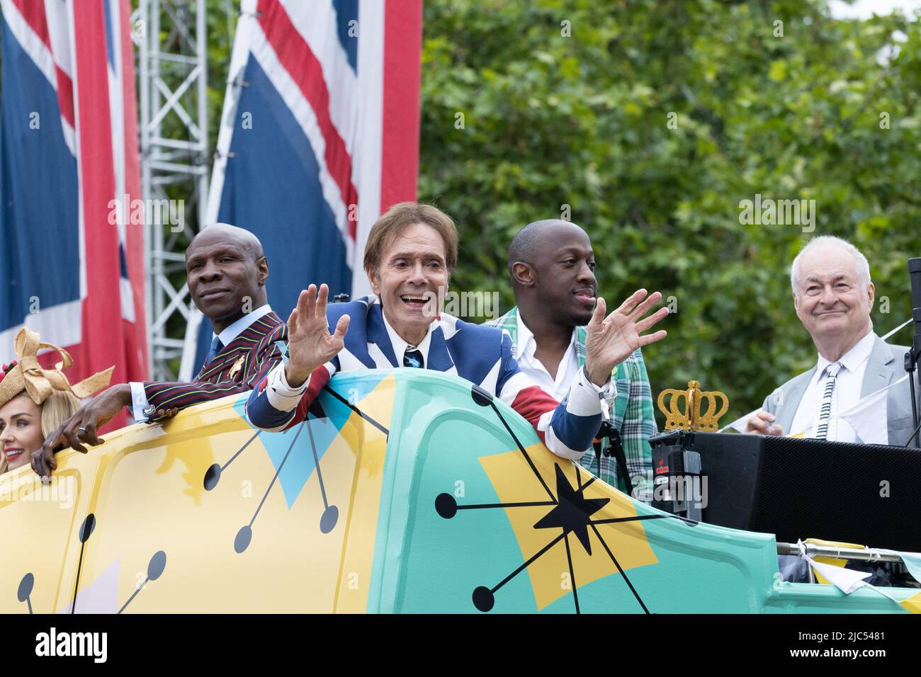 5th June 2022 - Cliff Richard, Chris Eubank and Paul Gabaccini on open top bus at Queen Elizabeth's Platinum Jubilee Pageant on the Mall in London, UK Stock Photo