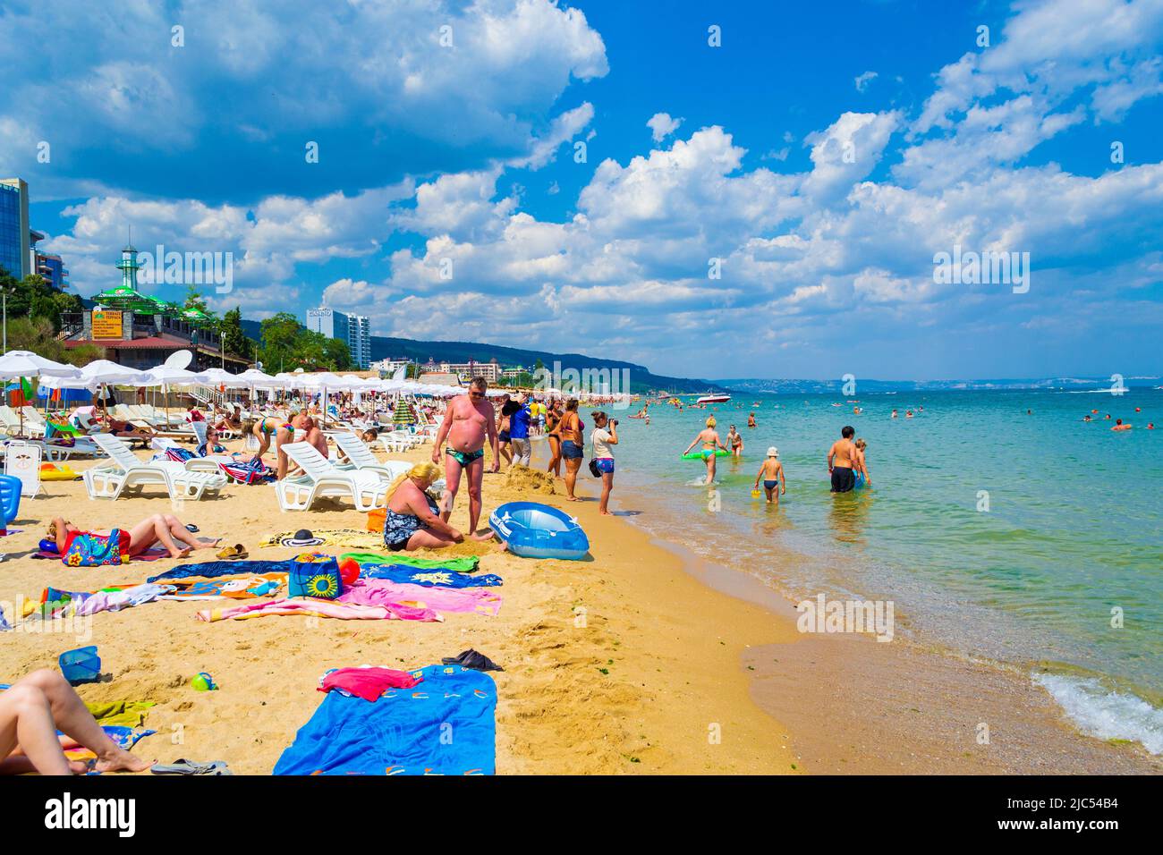 Vacationers relaxing on crowded beach of Bulgarian resort Golden Sands,Black Sea coast Stock