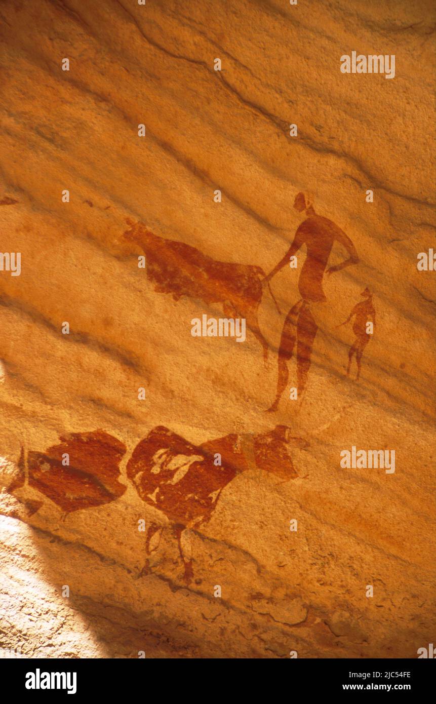 Neolithic rock painting of pastoral scene, Bovidian period, c. 6,500 years BP, Tassili N'Ajjer, Sahara desert, South Algeria Stock Photo