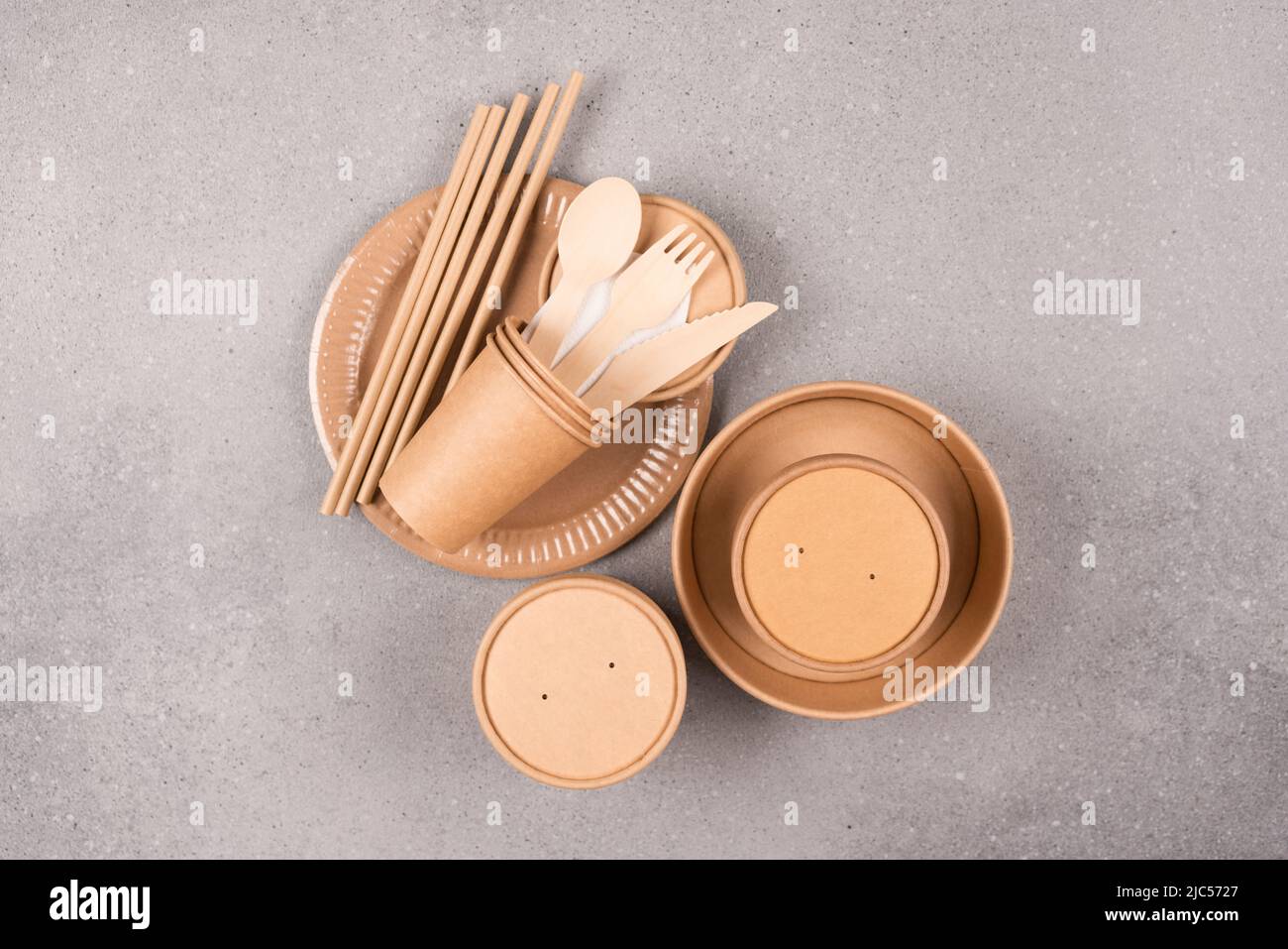 Sustainable food packaging concept. Paper tableware and utensils