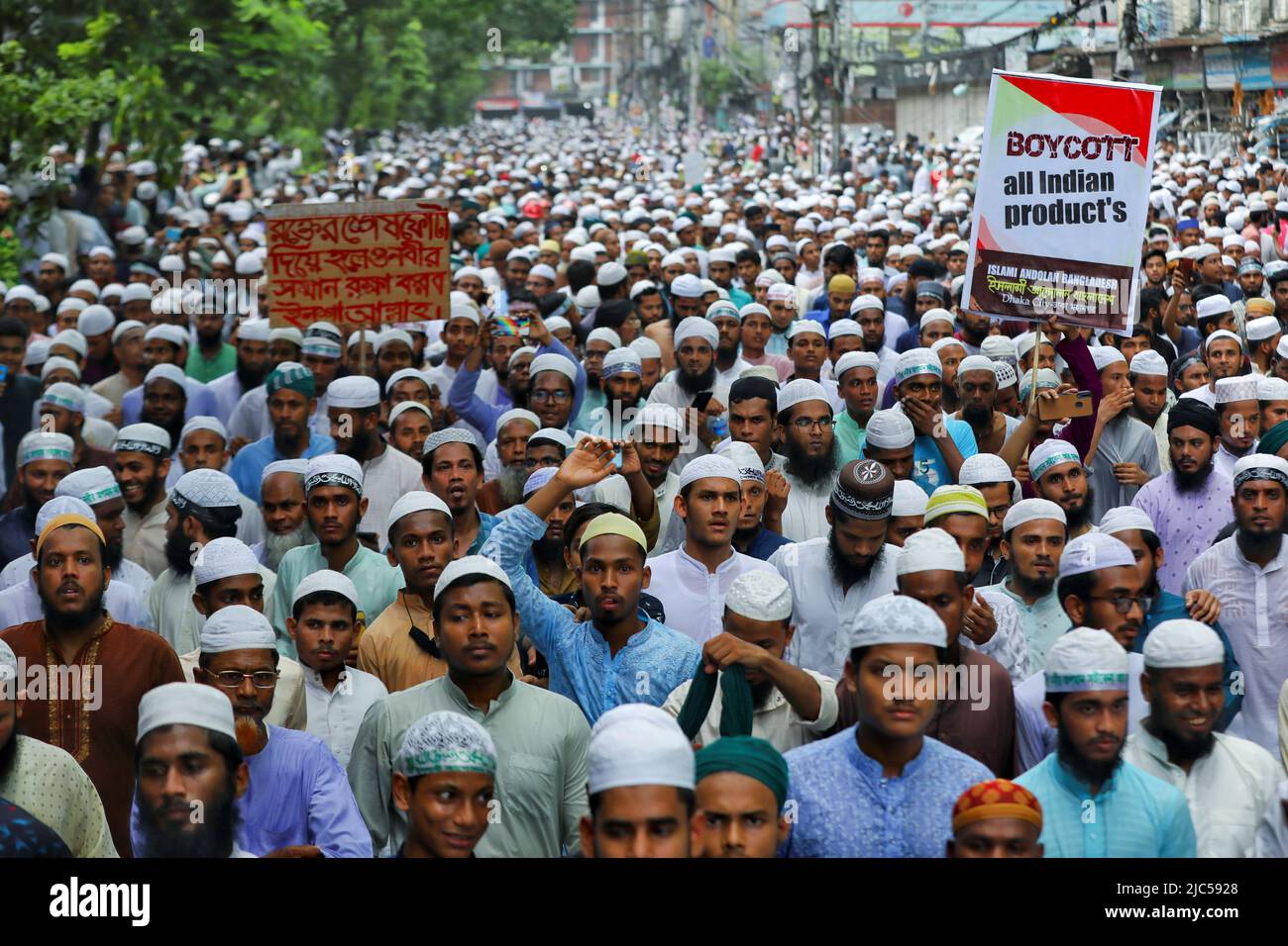 Muslims take part in a procession after Friday prayer to protest against the blasphemous comments on Prophet Mohammed by the members of the Indian Bharatiya Janata Party, in Dhaka, Bangladesh, June 10, 2022. REUTERS/Mohammad Ponir Hossain Stock Photo