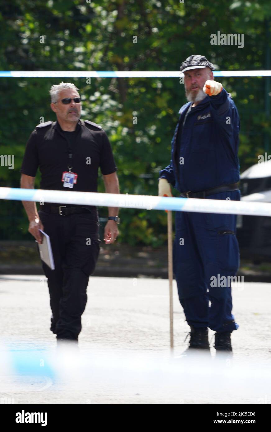 Ferocious Police Police officers at the scene in Bednal Avenue, Miles Platting ...