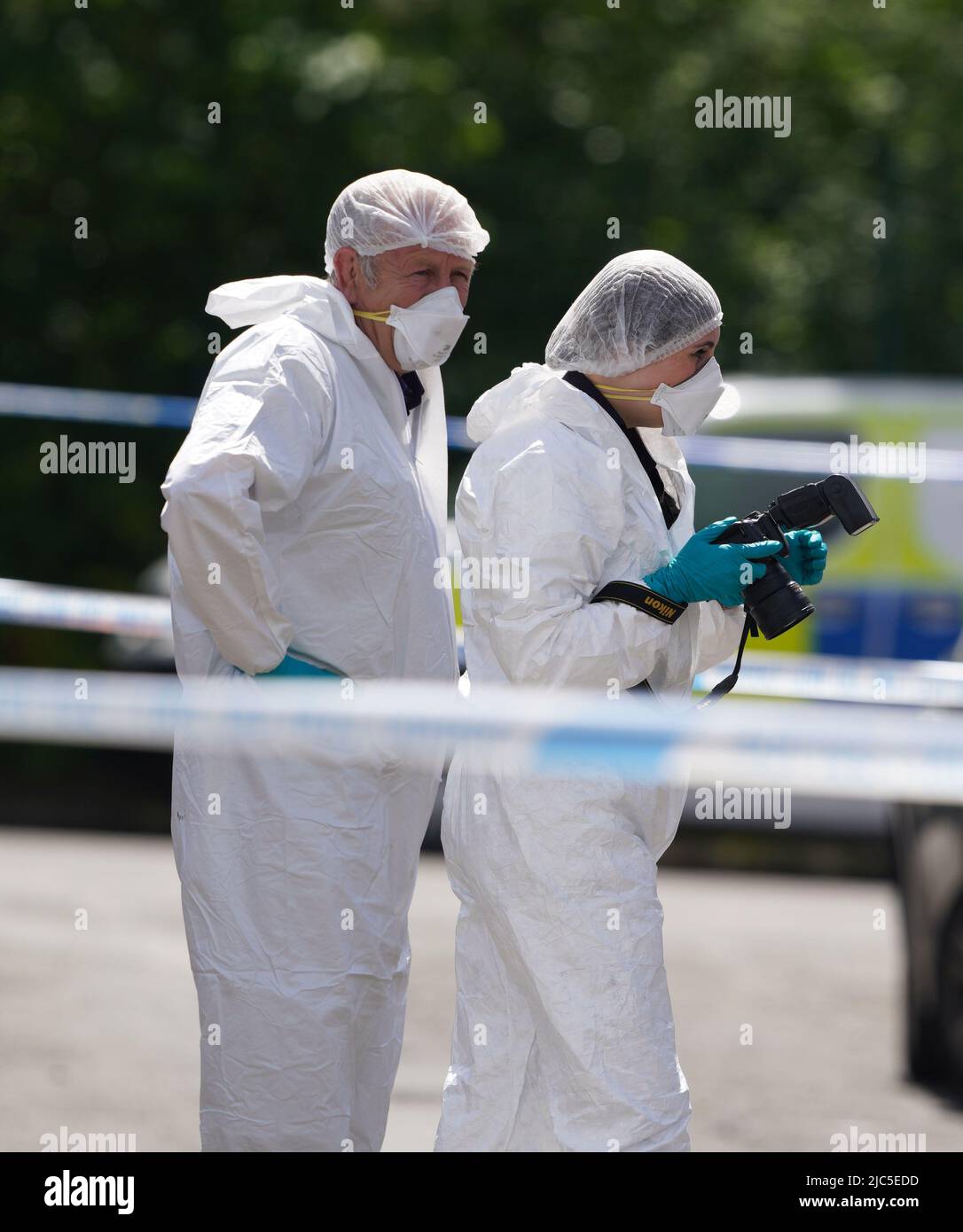 Ferocious Police Forensic officers at the scene in Bednal Avenue, Miles Platting ...