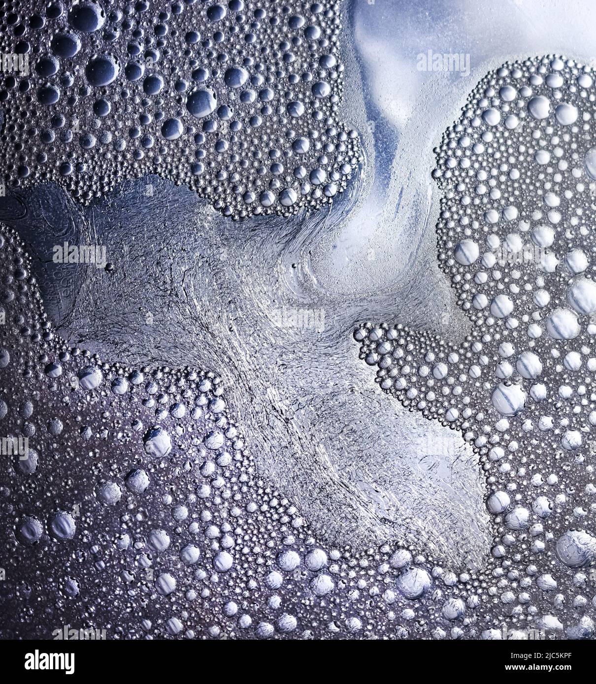 Bubbles made from water, dish liquid, oil, and food coloring creating a other worldly bubble landscape effect Stock Photo