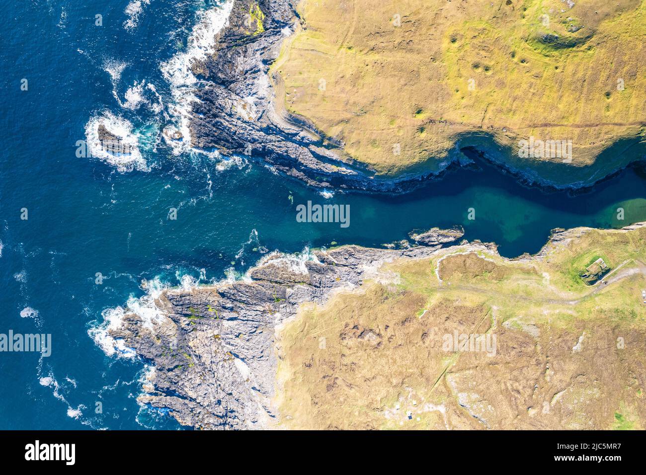 Top Down view over Geodha Smoo and Smoo Cave Cliffs from a drone, NC500, North Scotland Stock Photo