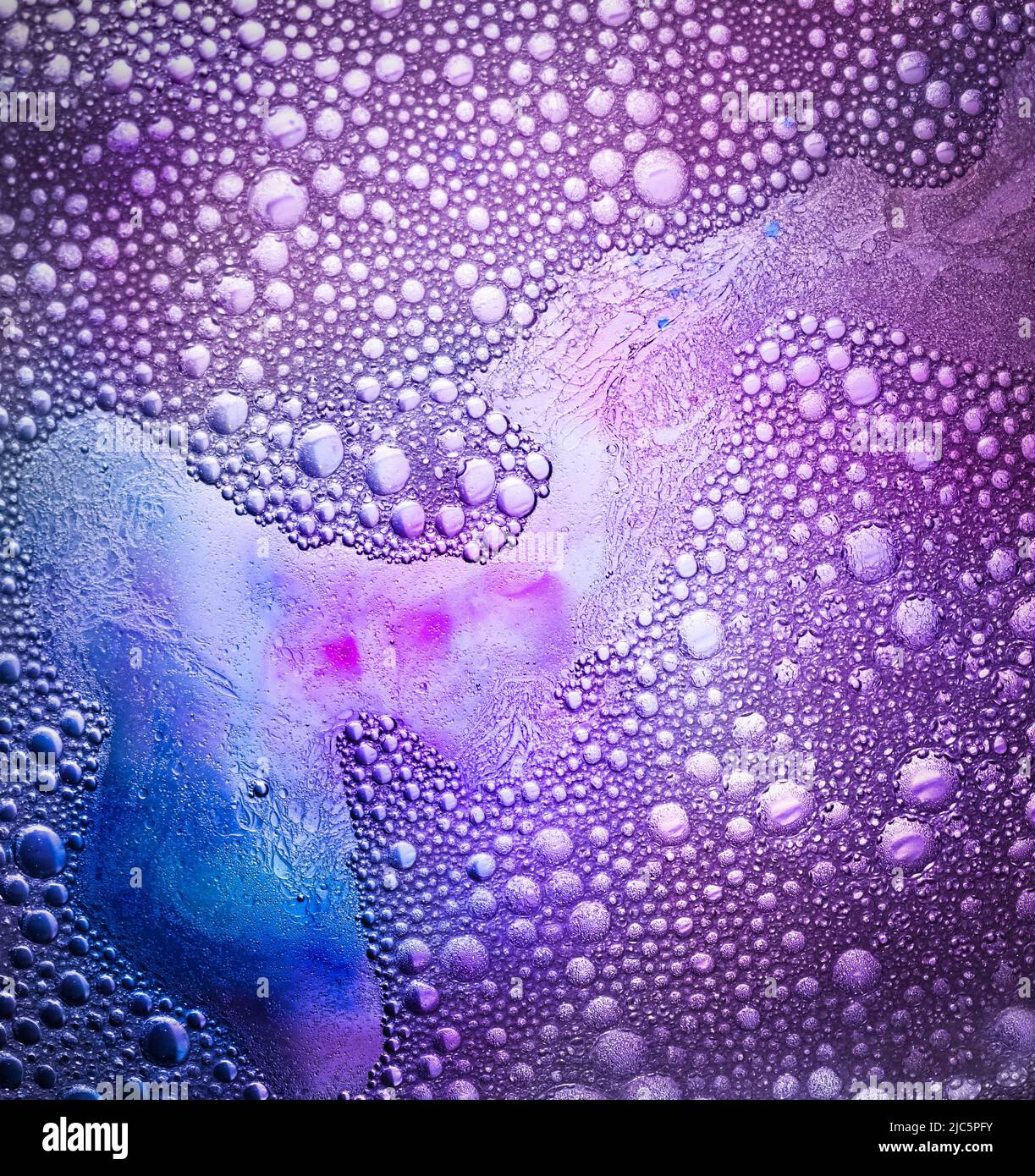 Bubbles made from water, dish liquid, oil, and food coloring creating a