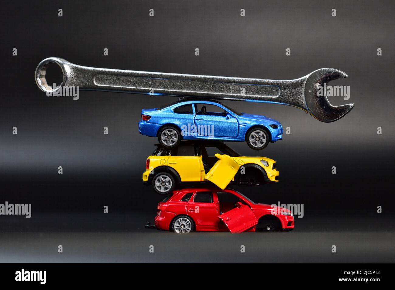 broken toy cars with wrench tool Stock Photo Alamy