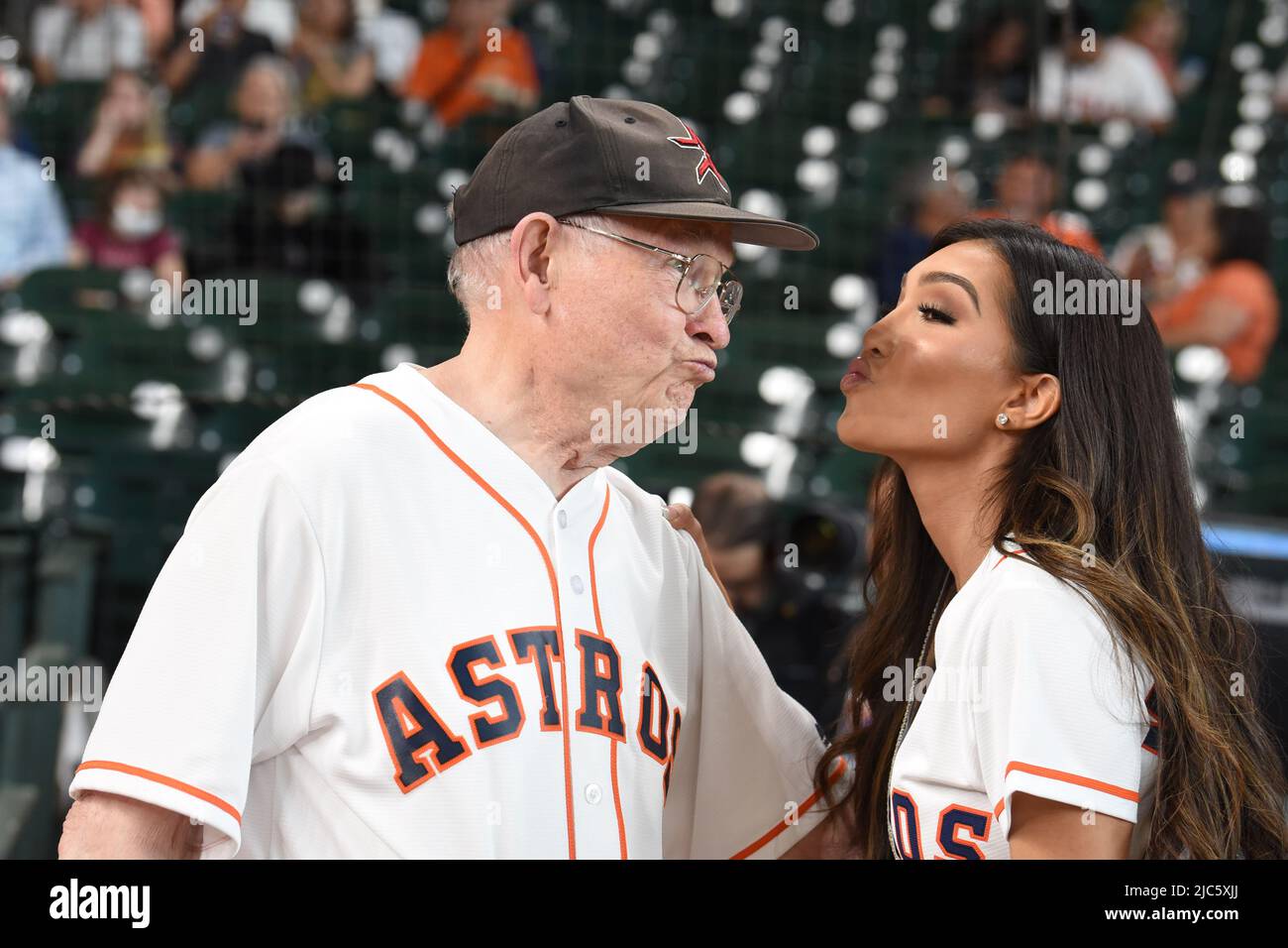 Astros fan Dennis Gregg and Miss Texas Victoria Hinojosa playing around before the MLB game between the Houston Astros and the Seattle Mariners on Tue Stock Photo