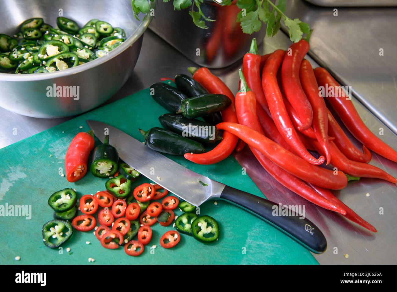 Chillies in a restaurant kitchen. Stock Photo