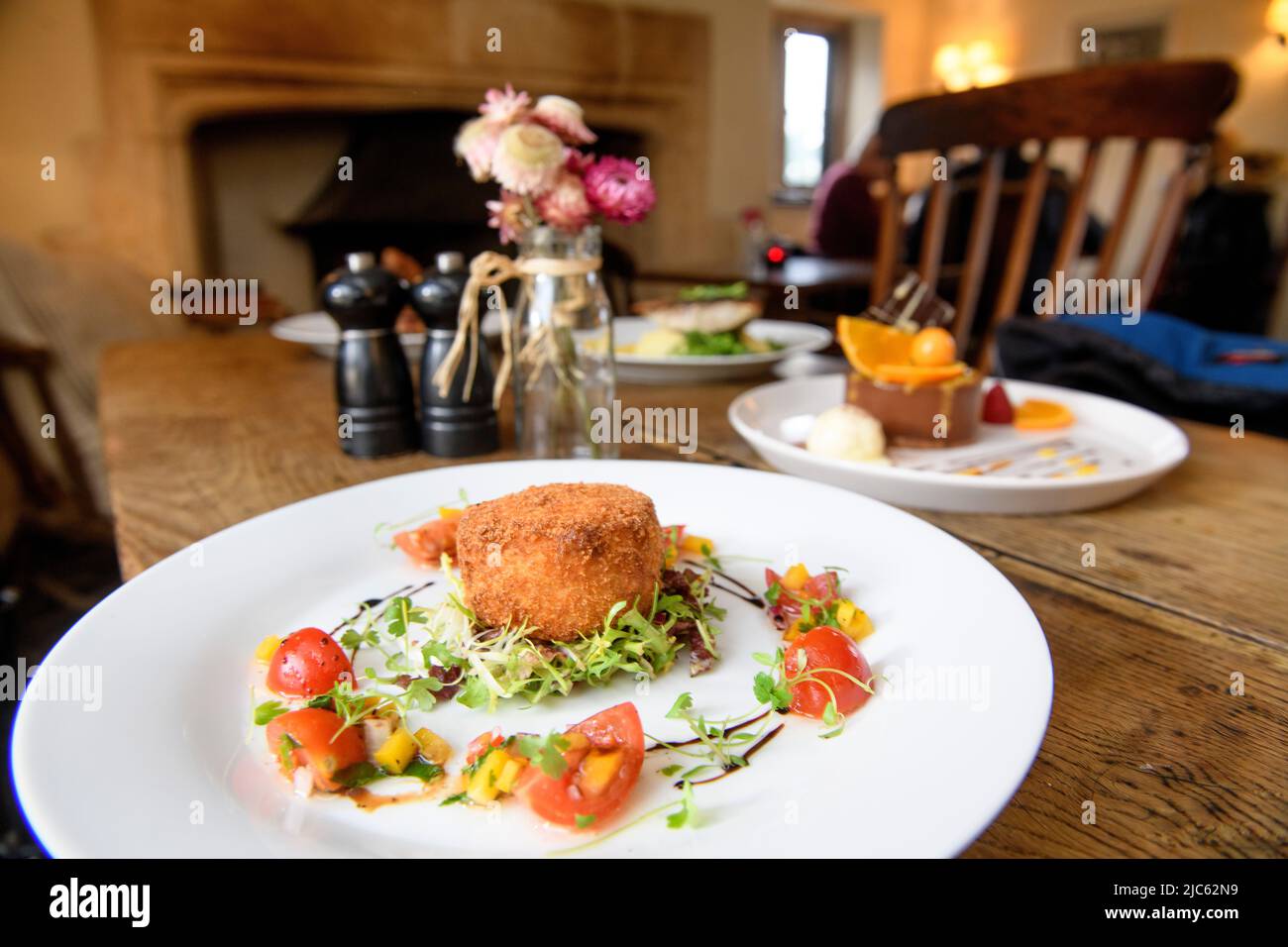 Modern cookery at a traditional English pub - Smoked Salmon & Crayfish fishcake. Stock Photo