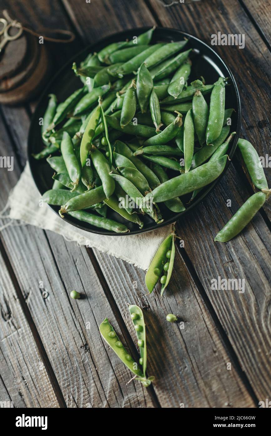 low key food photography, green peas vitamins, vegetarian food Stock Photo Alamy