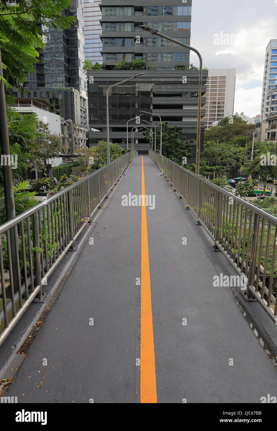 Pedestrian pathway or corridor or hallway between building Stock Photo