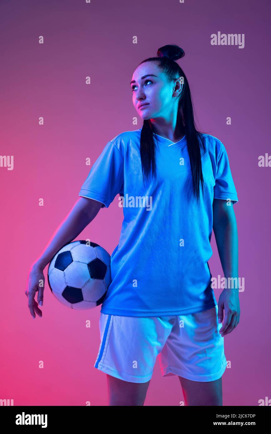 Portrait of beautiful girl, professional female soccer player posing