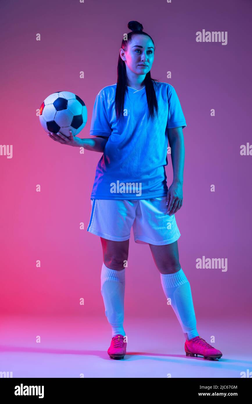 Portrait of beautiful girl, professional female soccer player posing