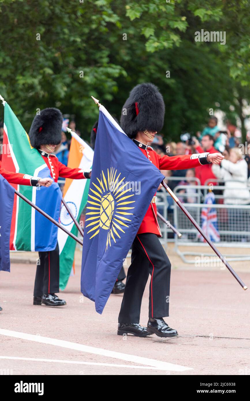 Flags of the Commonwealth marched in for Queen and Country section at the Queen's Platinum Jubilee Pageant parade in The Mall. Commonwealth flag Stock Photo