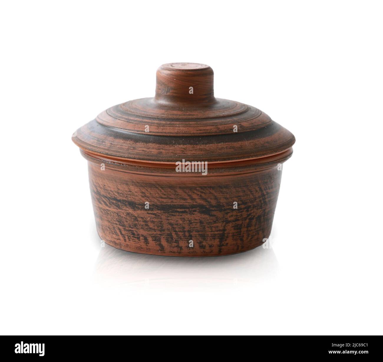 Brown ceramic pot pan with cover isolated on white with shadow.Kitchenware. Stock Photo