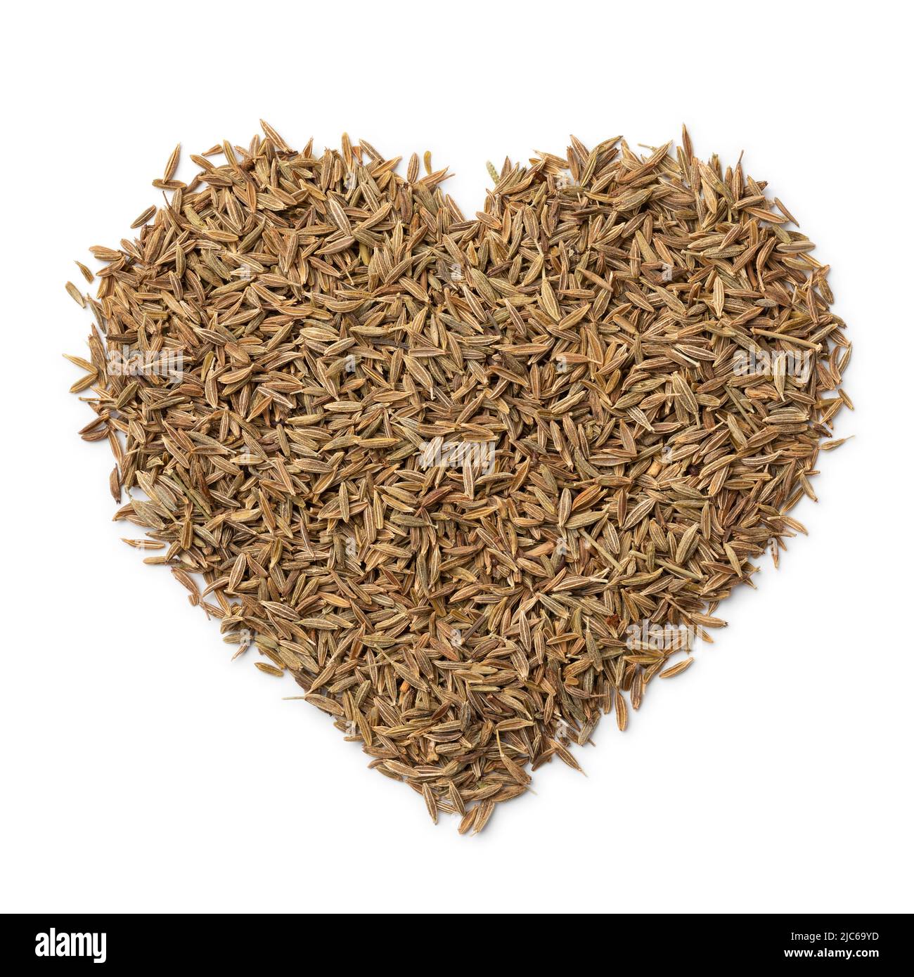 Dried whole cumin seeds in heart shape isolated on white background