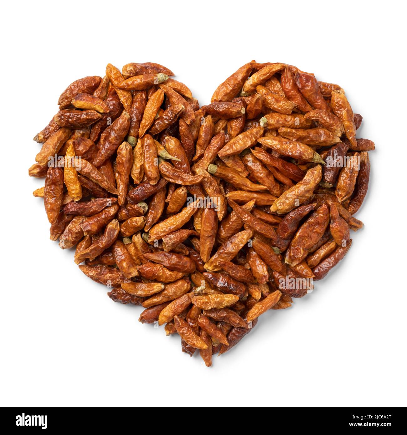 Dried chili peppers in heart shape isolated on white background close up Stock Photo