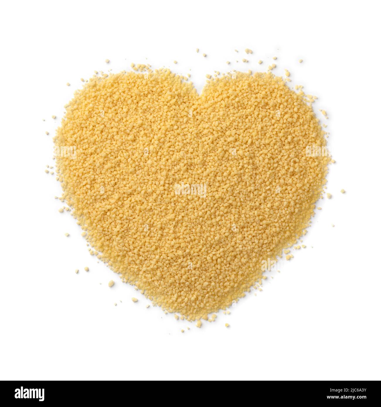 Dried uncooked couscous in heart shape isolated on white background Stock Photo
