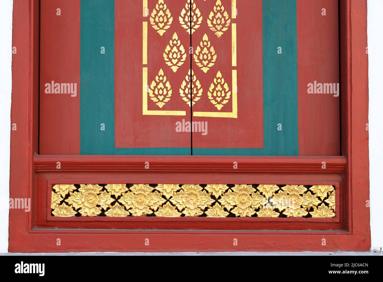 Beautiful pattern of traditional Thai art decorated made from mirror tile at a door of a public Buddhist temple ,textures background Stock Photo