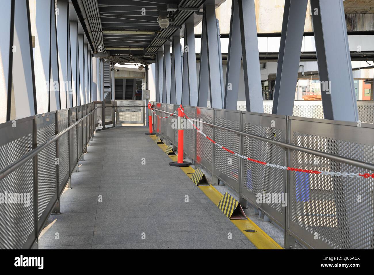 Pedestrian pathway or corridor or hallway between train station and