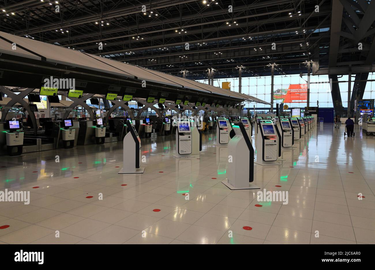 Self Check-in or Self service machine and help desk kiosk at airport for check in, printing boarding pass or buying ticket. Stock Photo