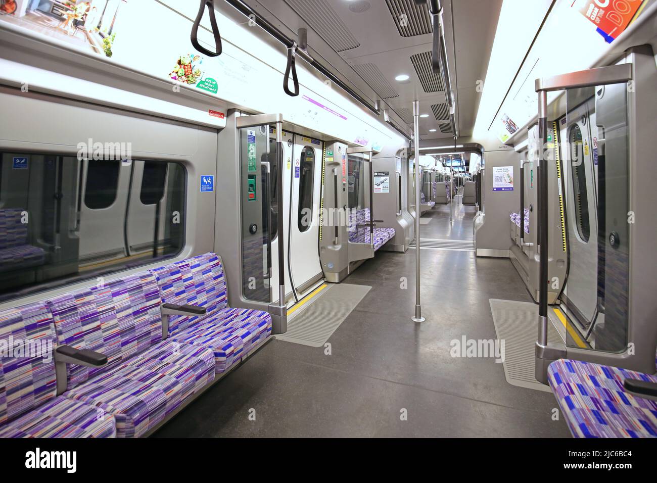 Interior of a train carriage on London's new Elizabeth Line (Crossrail) as it runs underground across the city. No passengers visible. Stock Photo