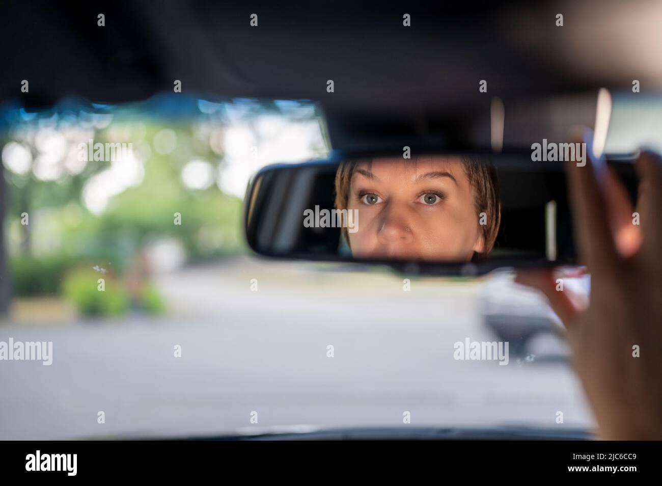 Woman's reflection rear view mirror hi-res stock photography and images ...