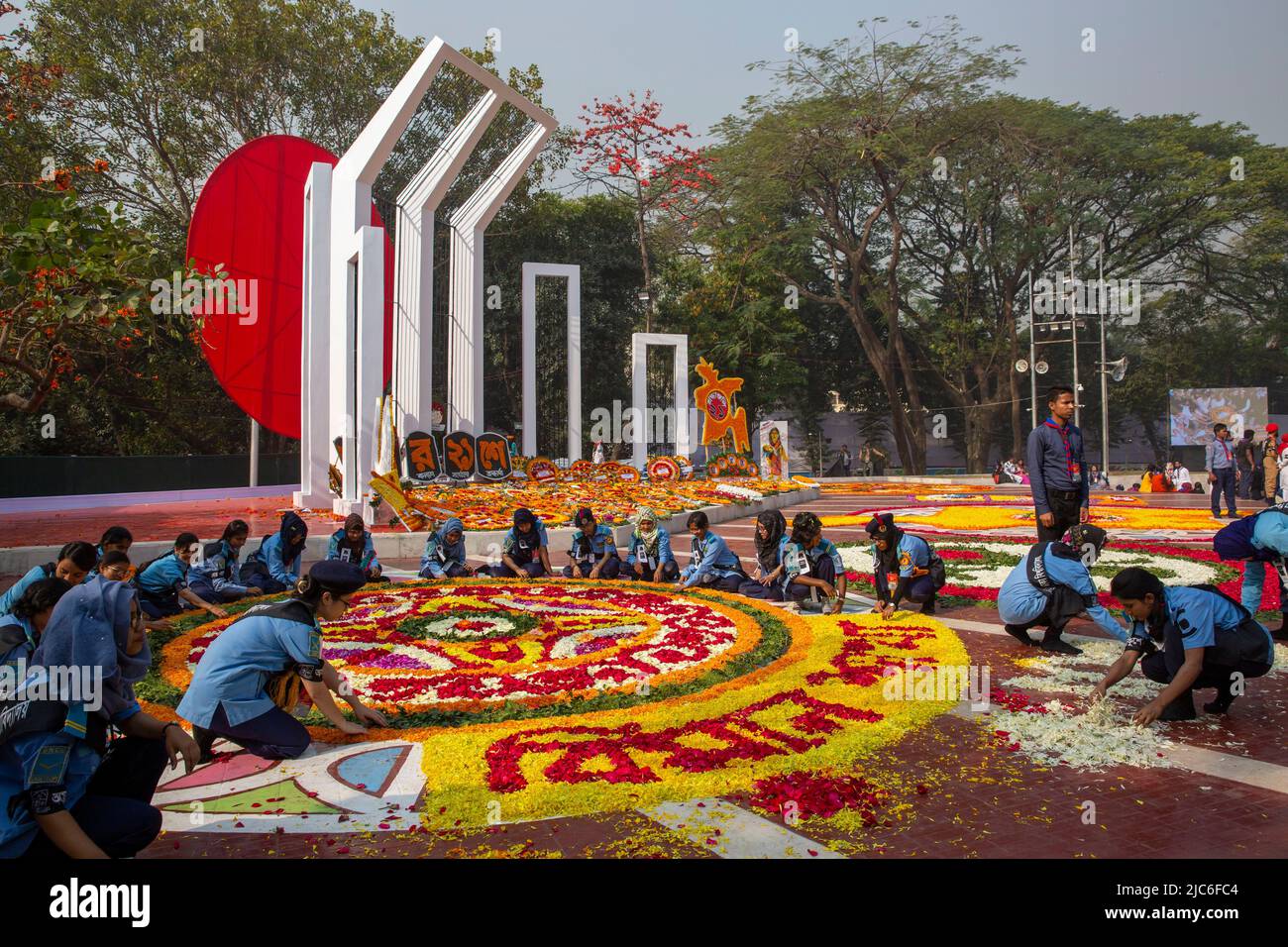 Volunteers busy decorating the Central Shaheed Minar with flowers on 21st February to honor the martyrs of the Language Movement. Dhaka, Bangladesh. Stock Photo