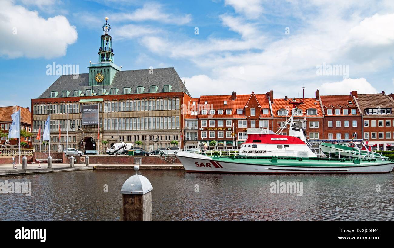 Emden, Lower Saxony, Germany - 19 June 2021: Inland harbor Ratsdelft in Emden with the historic town hall Stock Photo