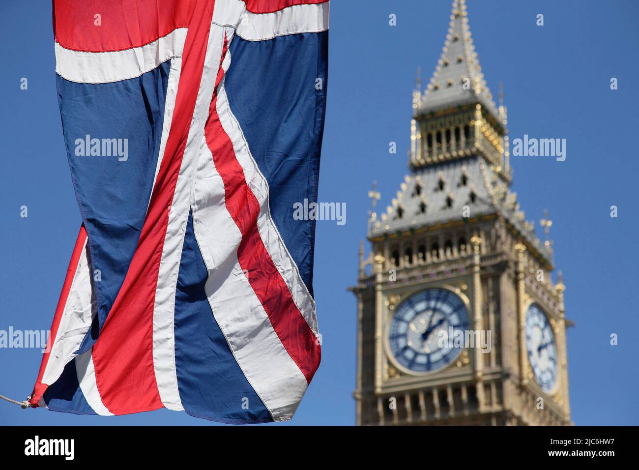 England, London, Parliament, Recently cleaned Big Ben with the Union Jack flag flying in the fioreground. Stock Photo