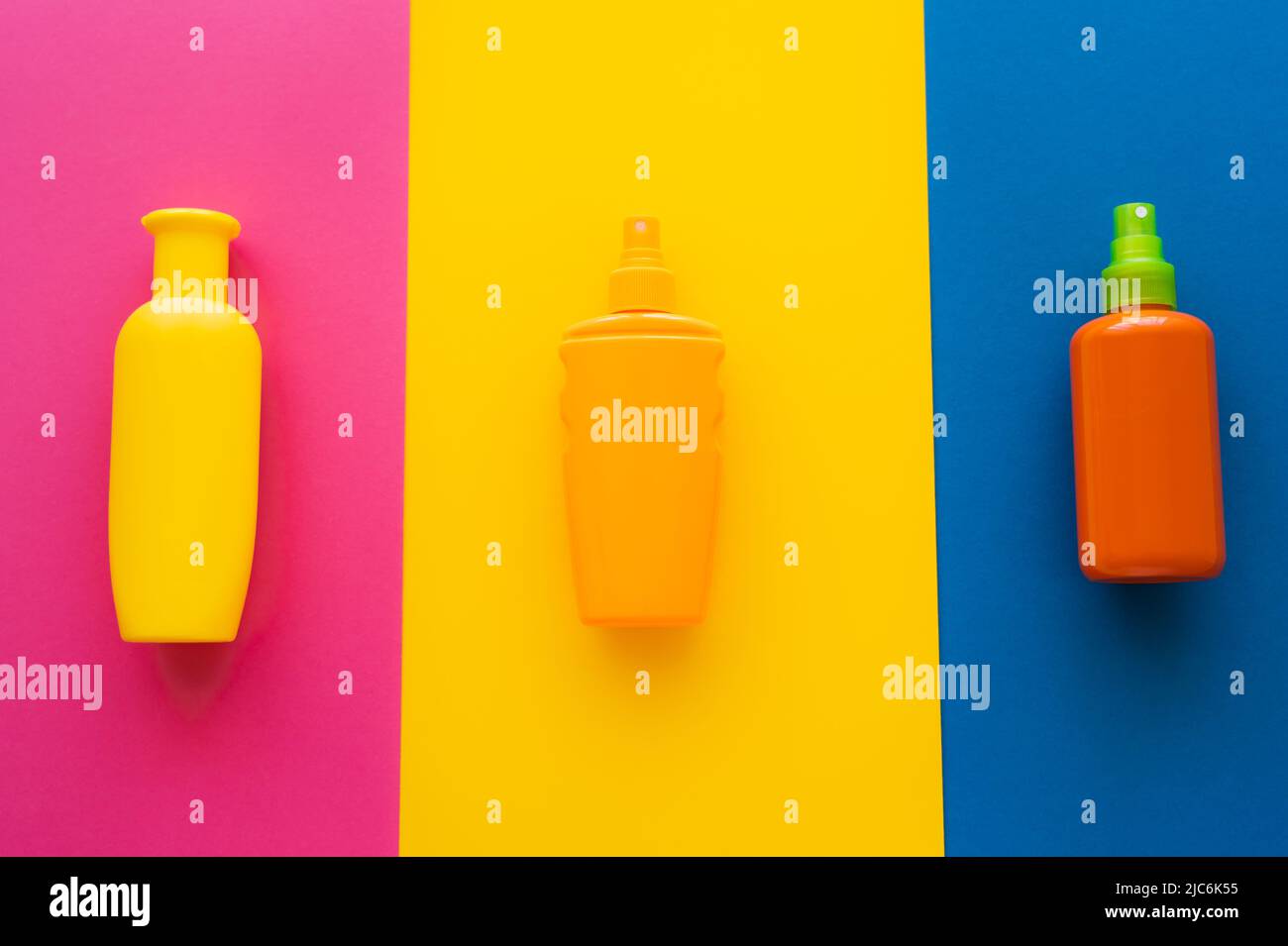 Top view of sunscreens on colorful background Stock Photo