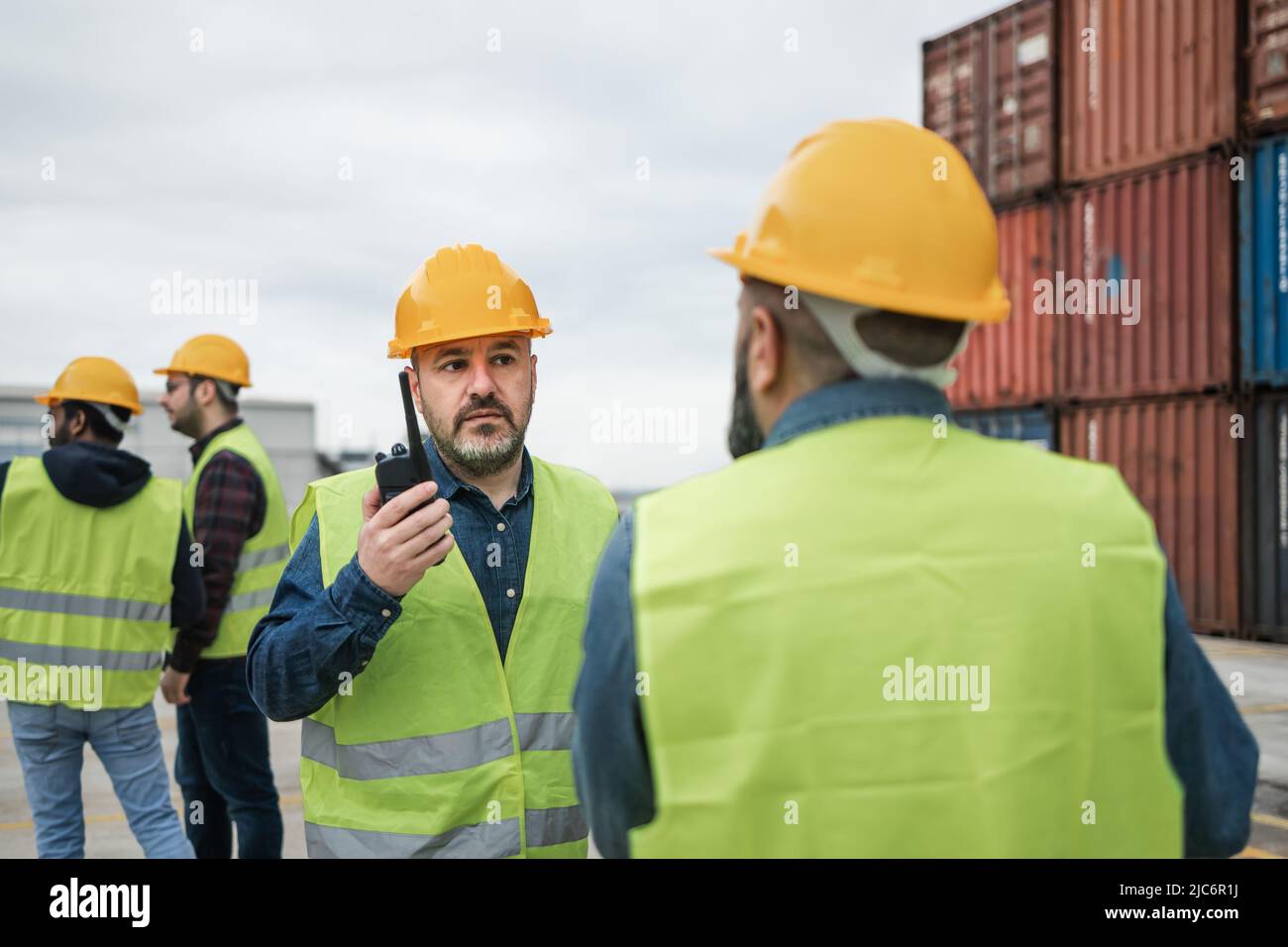 Industrial engineers working in logistic terminal of container cargo Stock Photo