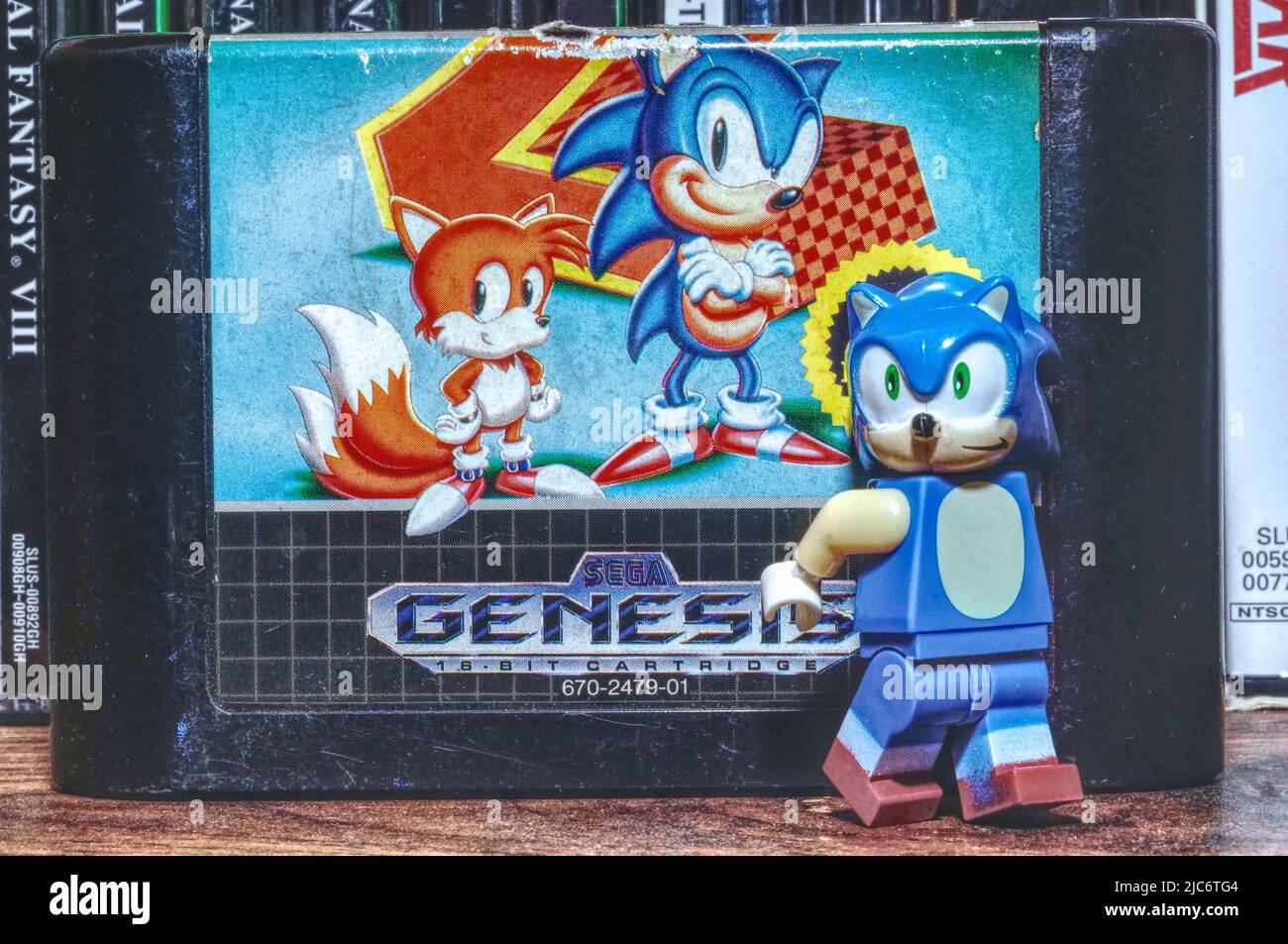 Lego Sonic figurine standing beside Sonic the Hedgehog 2 cartridge, with a paint effect on the photo (NC State, 2022) Stock Photo