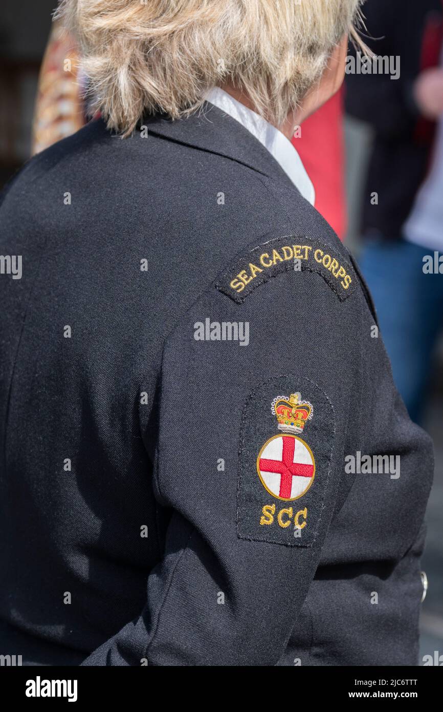 The shoulder titles patches flashes on the tunic of an officer in the Sea Cadet Corps at the Military Day at Trebah Garden in Cornwall in the UK. Stock Photo