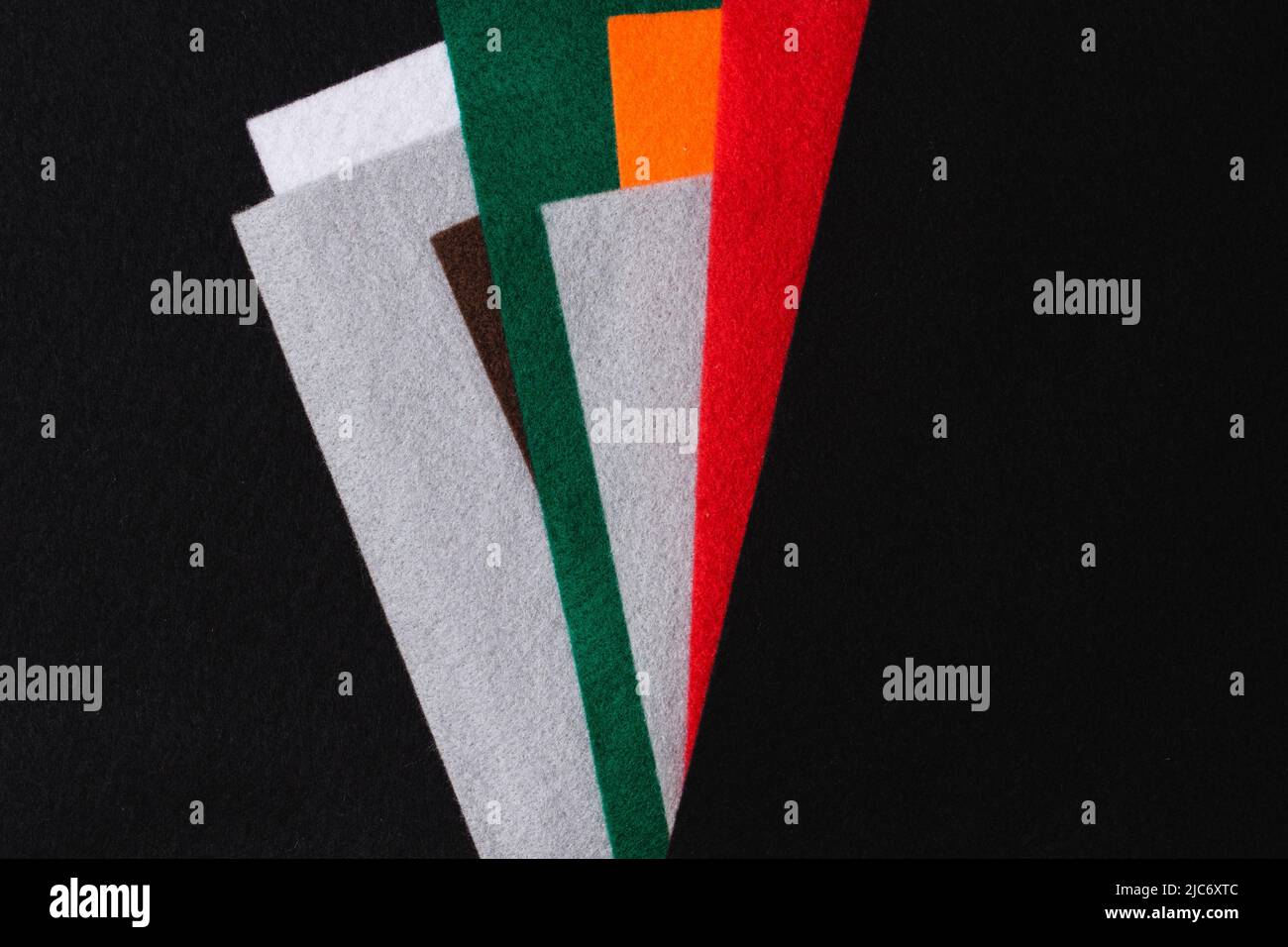 Several colored felt texture background. Assorted color felt fabric sheets, patchwork, sewing DIY craft Stock Photo