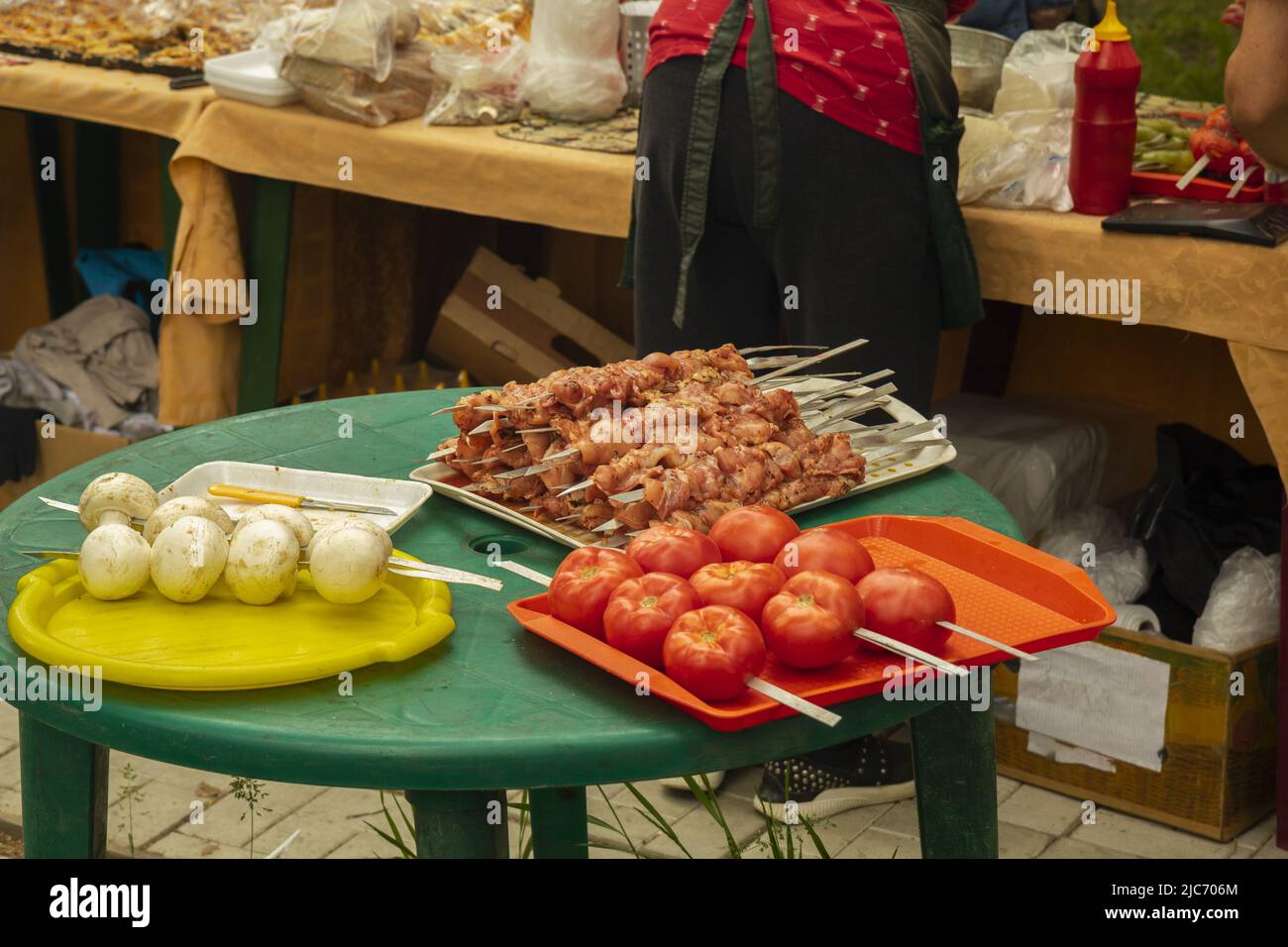 Raw meat prepared for frying with vegetables in the oriental market. Stock Photo