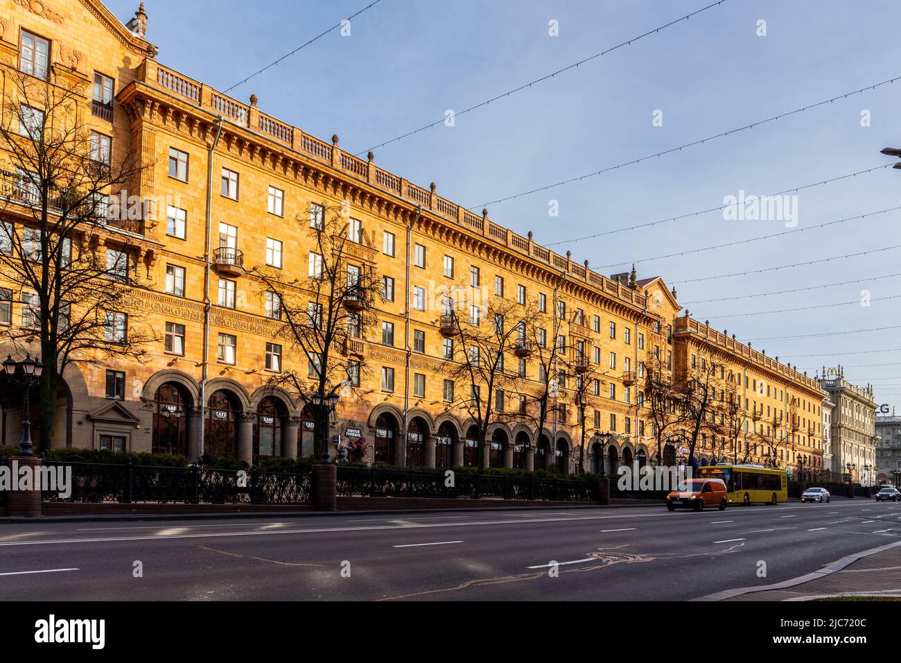 Minsk, Belarus, 04.11.21. Orange brick building in neo-classicism architecture style in Minsk on Lenin Street with cafes and restaurants. Stock Photo