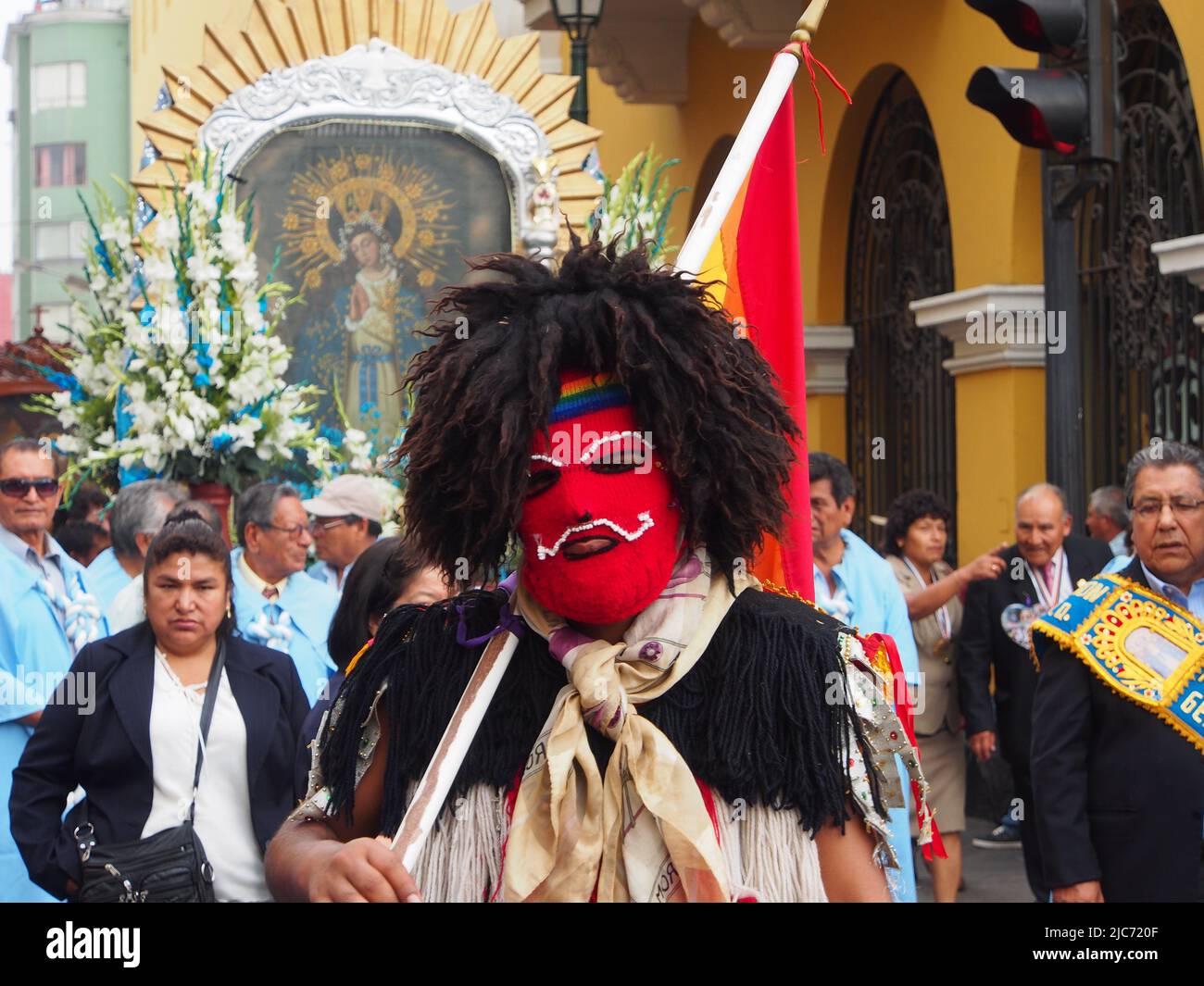 Masked Qoyllur Riti dancer, preceding the procession.Hundreds of people accompanied the images of the Quechua-speaking vicarage of San Sebastian and Monserrate, who went out in procession, greeting the City of Lima for the 482 anniversary of its foundation. Stock Photo
