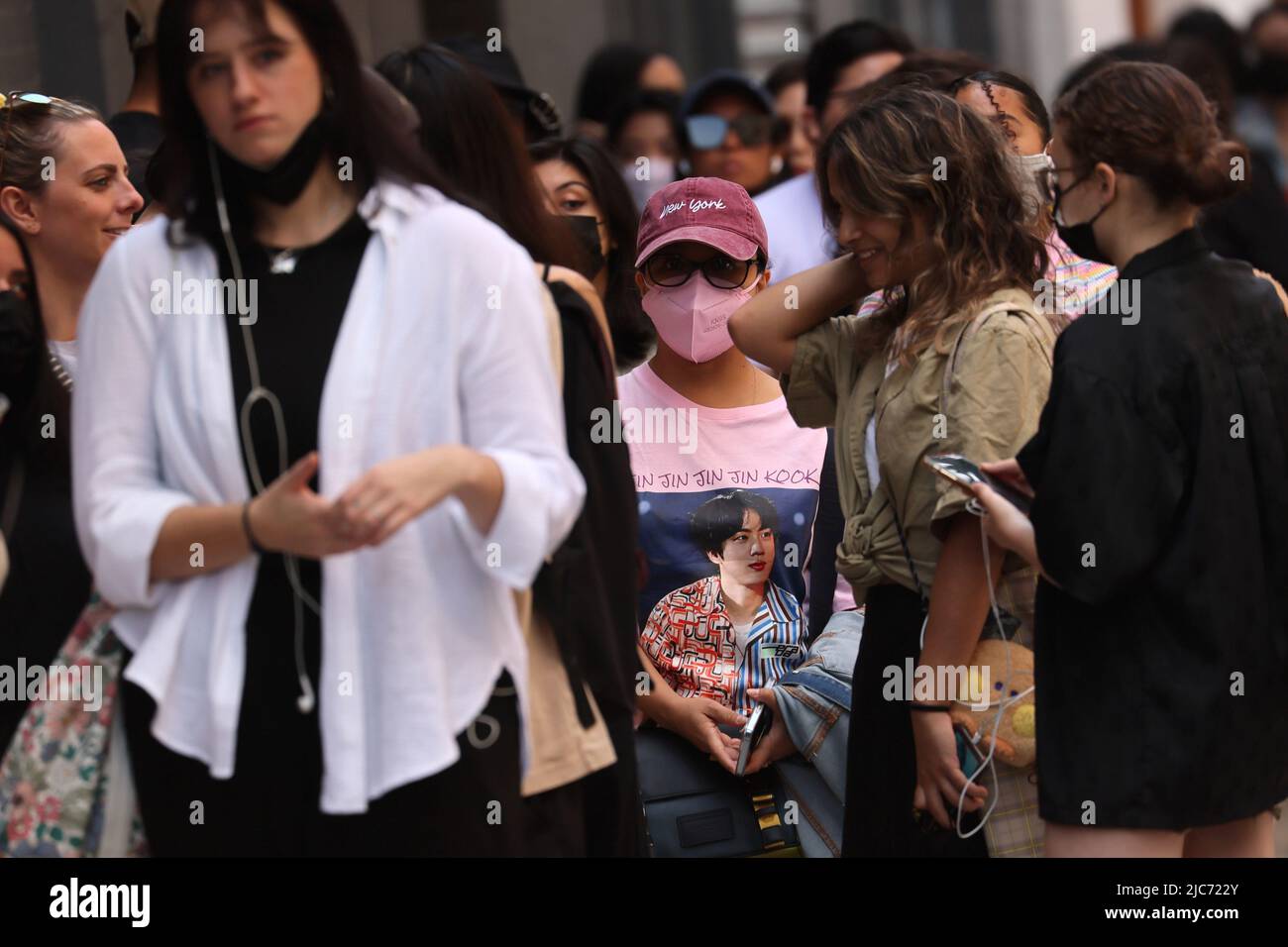 Fans of the South Korean boy band BTS wait in line to enter a pop-up shop selling BTS merchandise after the release of their new album 'Proof' in in Manhattan in New York City, New York, U.S., June 10, 2022. REUTERS/Mike Segar Stock Photo
