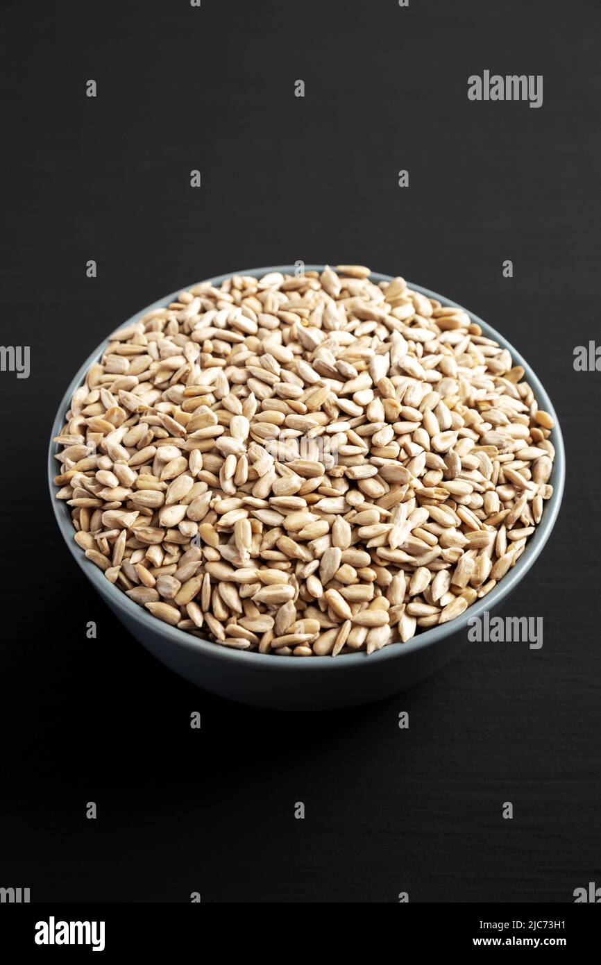 Raw Organic Sunflower Seed Kernels in a Blue Bowl, side view Stock Photo Alamy