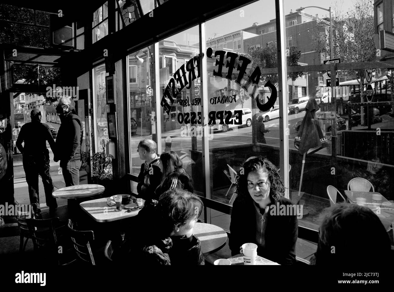 Customers enjoy coffee, espresso and pastries at the iconic Caffe Trieste in the Little Italy district of San Francisco, California. Stock Photo