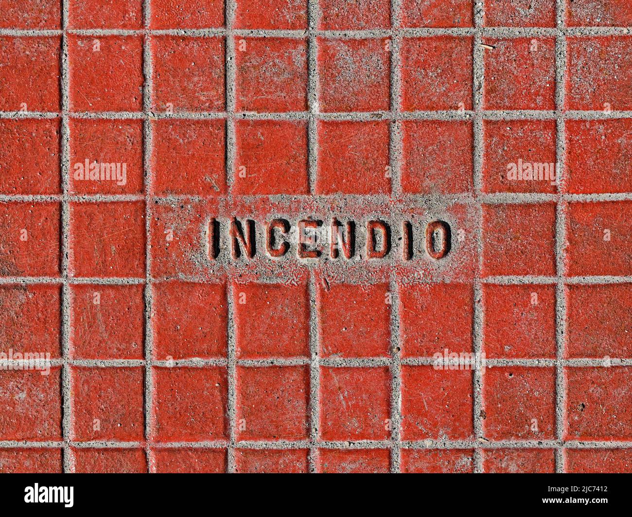 Metallic surface for access to the hydraulic system against fire (detail) with portuguese word that mean FIRE (Incendio) Stock Photo