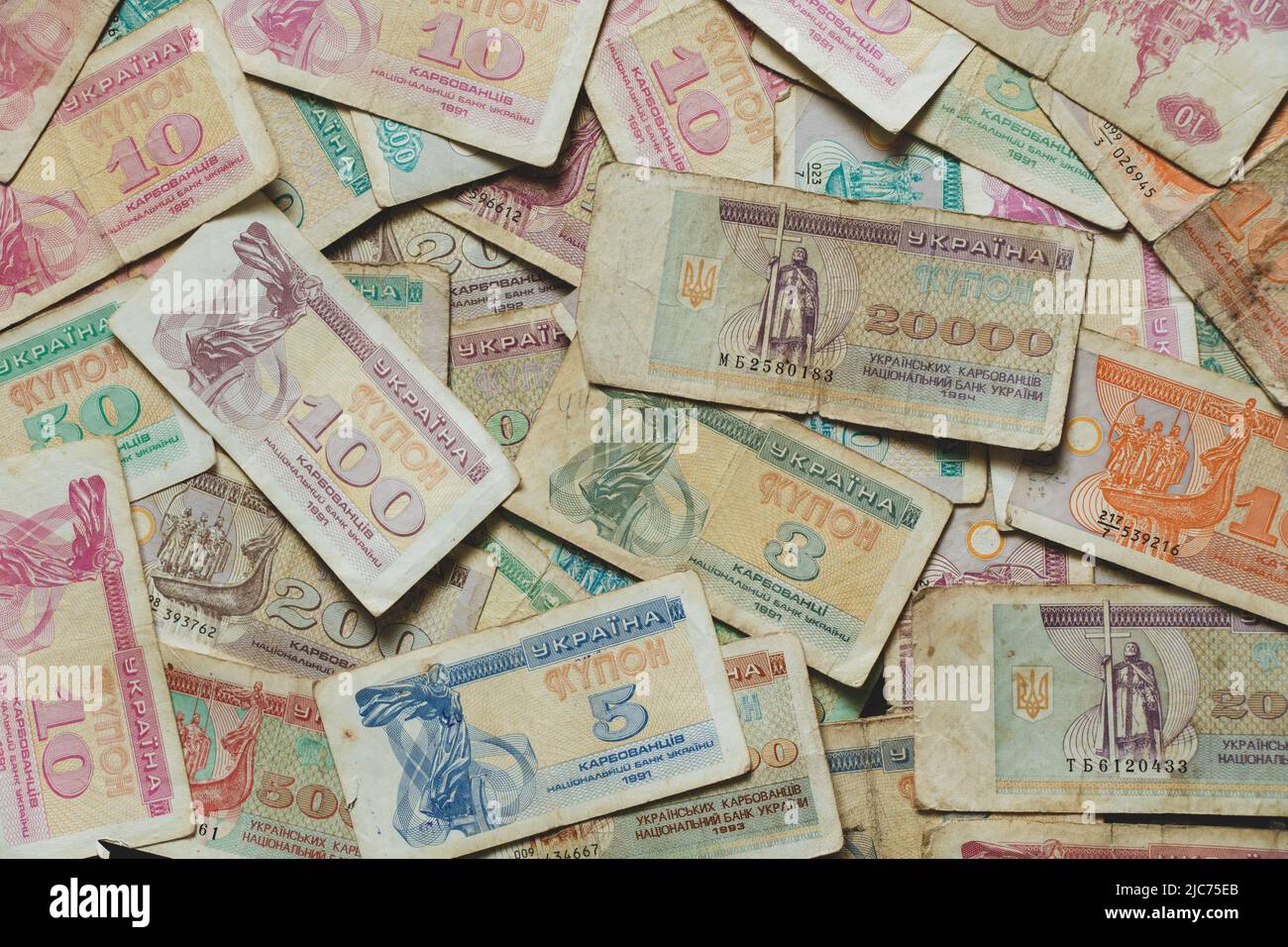 monetary unit of the Ukrainian state karbovanets different namenals lie on the table as a background, old money of ukraine, ukrainian money Stock Photo