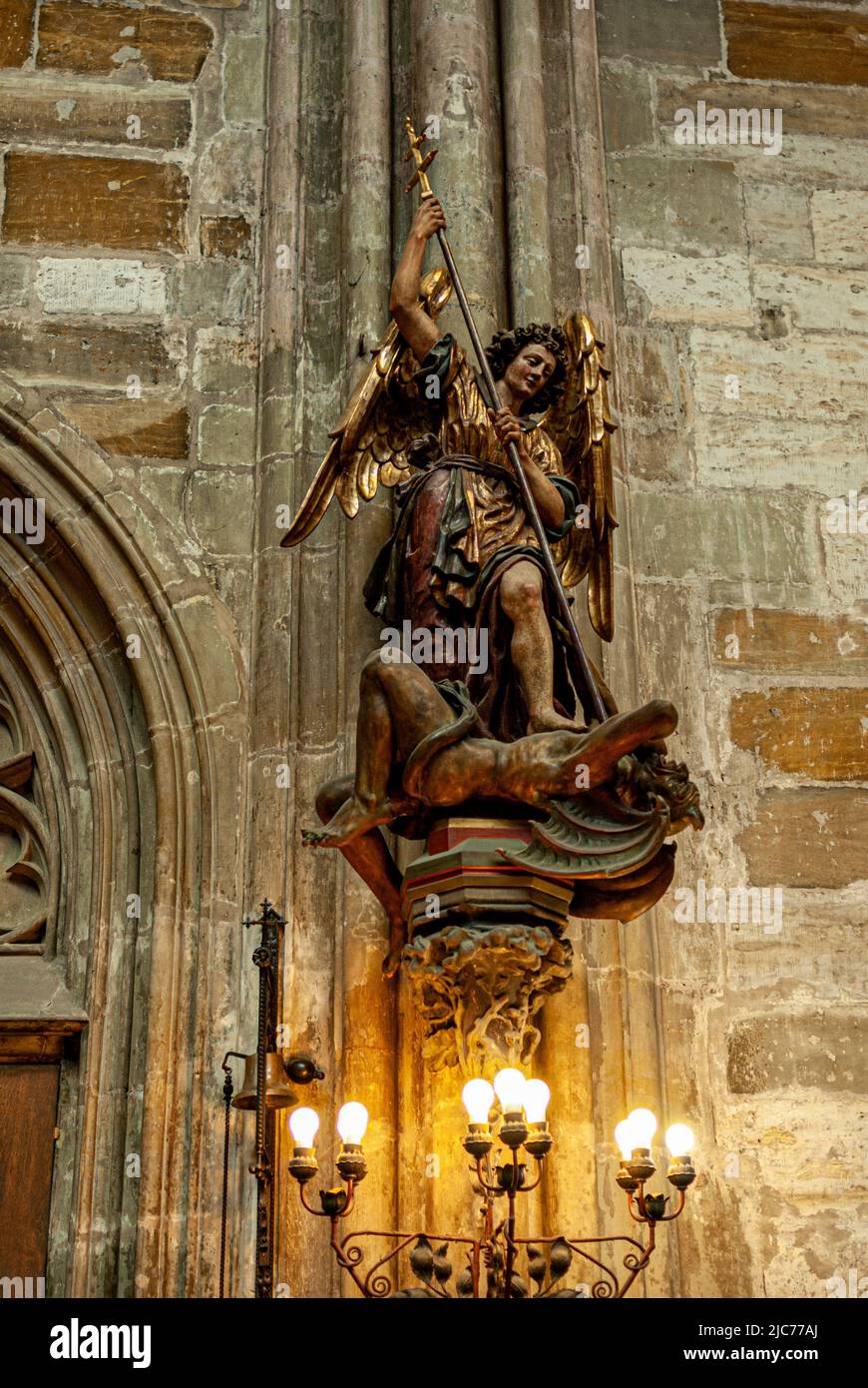 Statue of Archangel Michael fighting the devil. St. Vitas Cathedral. Prague, Czech Republic. 09/2007 Stock Photo