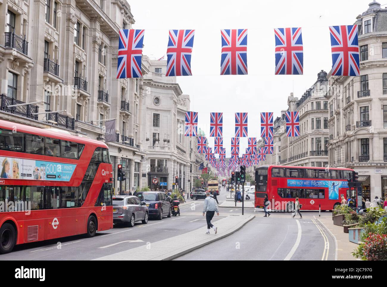 Queen Elizabeth Platinum Jubilee - London buses and street decorations with Union Jack Flags on Regent Street, Central London UK Stock Photo
