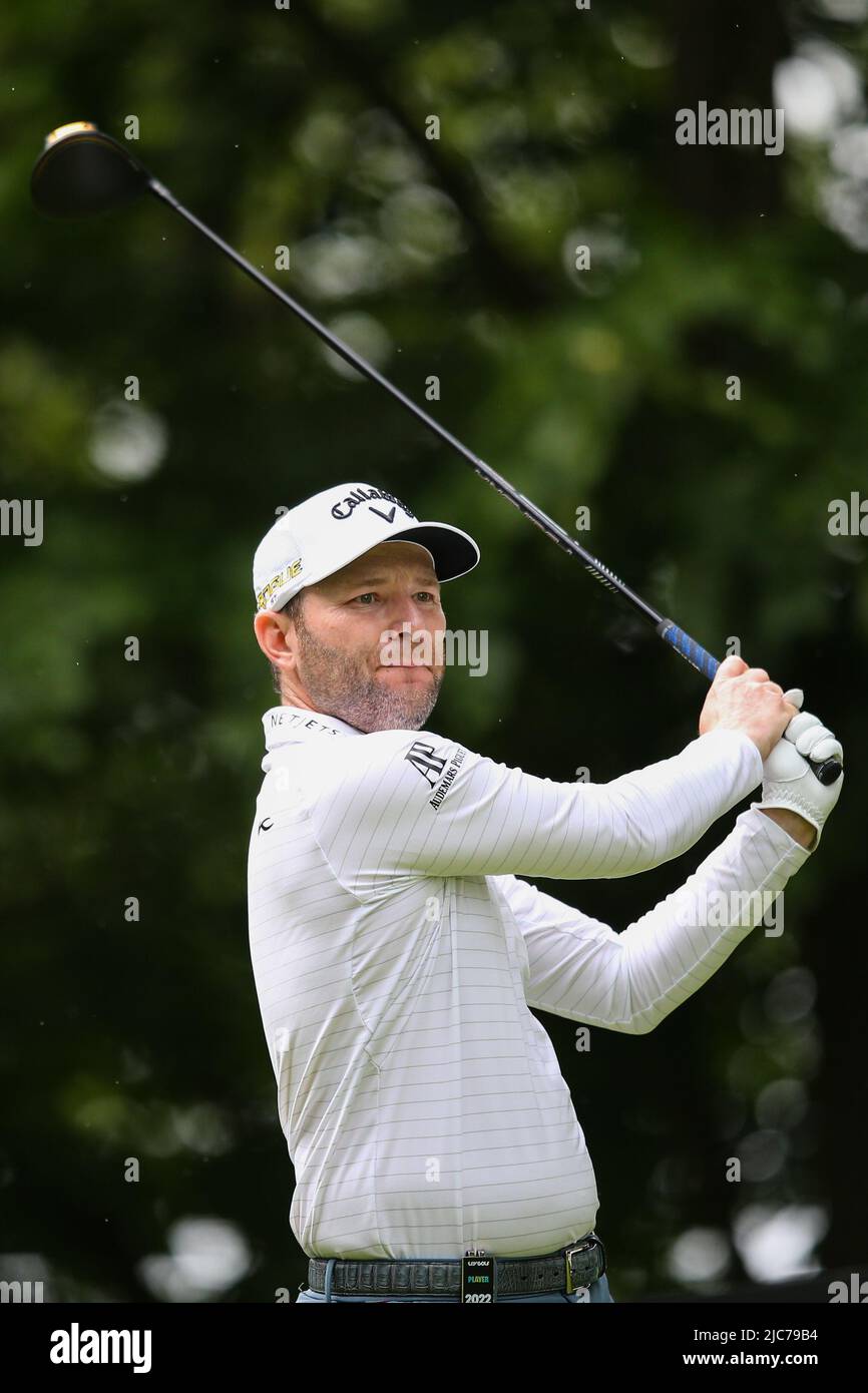 ST ALBANS, ENGLAND - JUNE 09: Branden Grace of South Africa tees off on the 4th hole during day one of the LIV Golf Invitational at The Centurion Club on June 9, 2022 in St Albans, England. (MB Media) Stock Photo