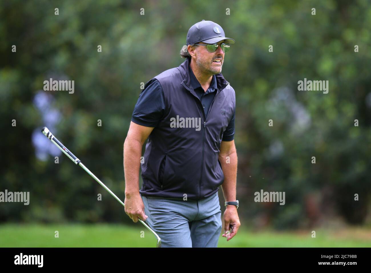 ST ALBANS, ENGLAND - JUNE 09: Phil Mickelson of the United States walks down the 3rd hole during day one of the LIV Golf Invitational at The Centurion Club on June 9, 2022 in St Albans, England. (MB Media) Stock Photo
