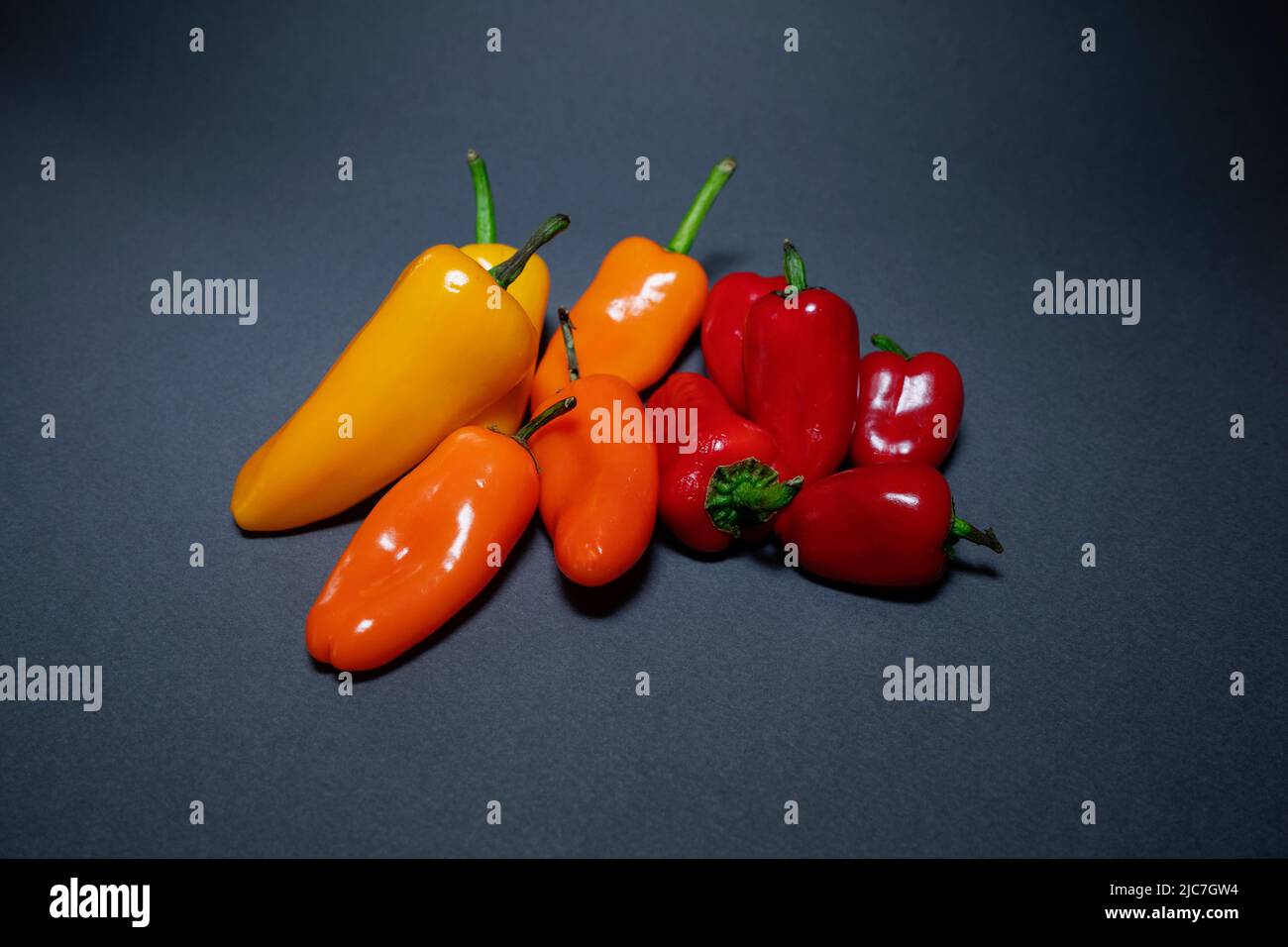 Colorful mini papers isolated on dark gray Stock Photo - Alamy