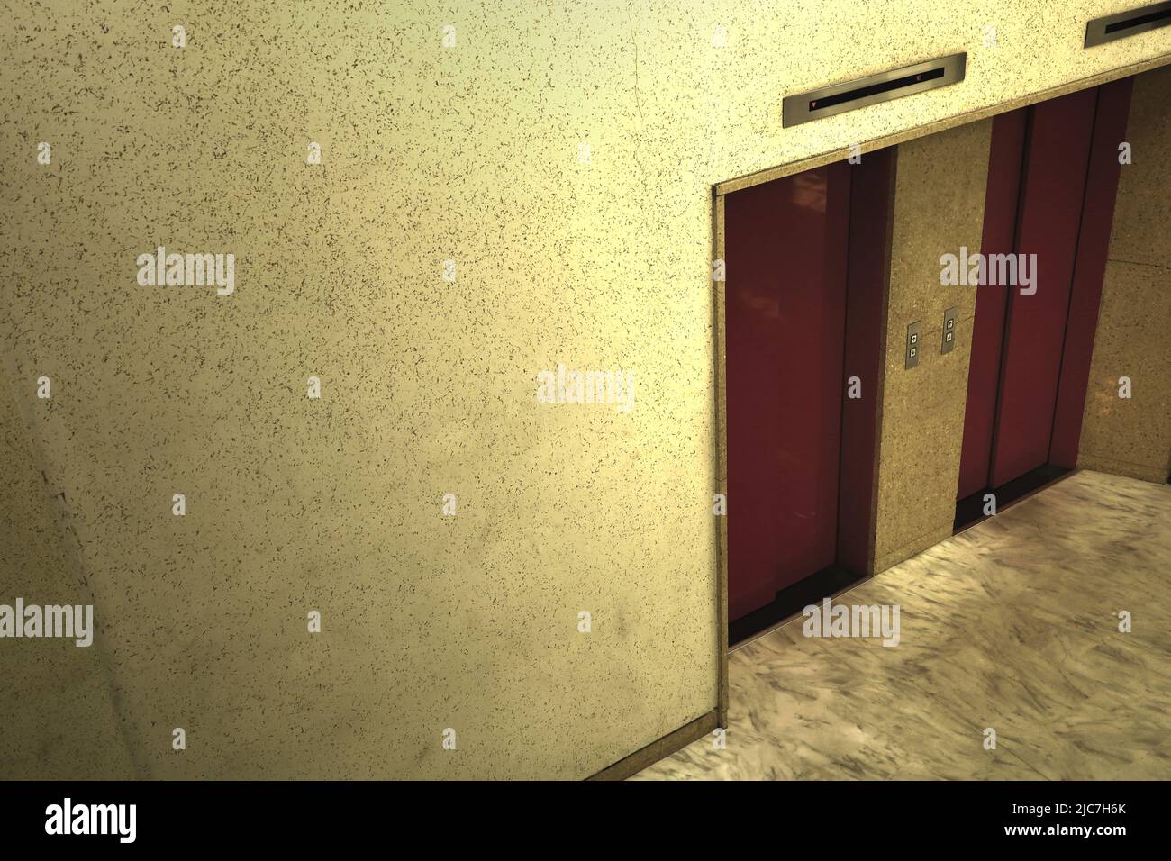 A dim elevator lobby with a retro ambience in the basement of an old building Stock Photo